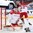 COLOGNE, GERMANY - MAY 6: Denmark's Sebastian Dahm #32 makes the save while Morten Green #13 keeps close watch on Latvia's Janis Sprukts #5 during preliminary round action at the 2017 IIHF Ice Hockey World Championship. (Photo by Andre Ringuette/HHOF-IIHF Images)

